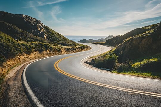 Winding coastal road curves along scenic oceanside cliffs