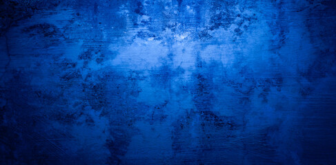 Abstract grunge background with copy space. Classic blue concrete wall. Texture for layout and graphic design.