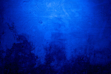 Abstract grunge background with copy space. Classic blue concrete wall. Texture for layout and graphic design.