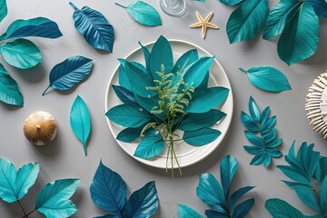 Coastal Summer Tabletop Decor with Blue and Turquoise Leaves on Light Gray Background