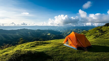 Camping Tent on Green Hill with Mountain View and Cloudy Sky