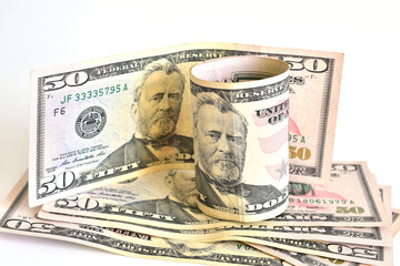 American paper money of the same denomination lies on a white background