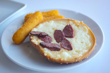 Delicious sandwich with savory toppings and crispy sides served hot