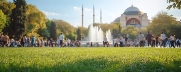A sunny day in a park with people and architecture