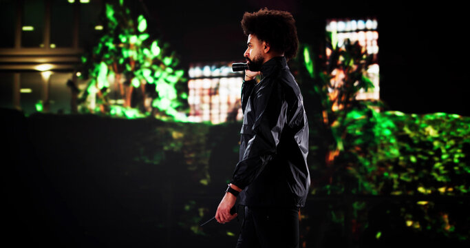 Late Night Patrol: African American Security Guard Monitoring Building