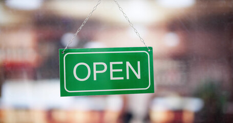 Female Owner Holding Closed Sign
