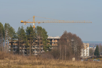 a large crane working on a new block