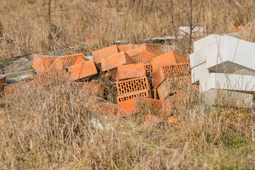 a pile of bricks in a field
