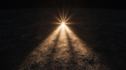 A spotlight shining on a dark surface.