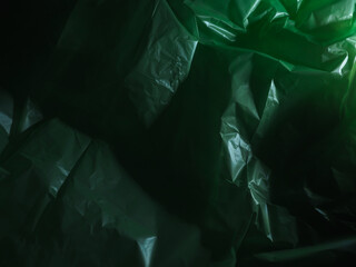 Plastic bag texture and light in the dark for mysterious background.   