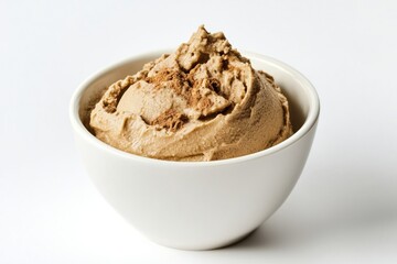 Delightful homemade creamy brown ice cream dessert with cinnamon in a bowl on clean white background in studio shot