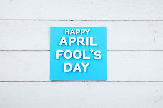 blue sticky note with the words Happy April Fools Day written on it