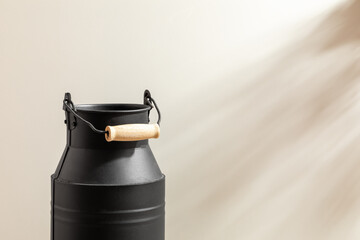 Black flower Container isolated on studio background. Minimalist. Product design. Simplicity. Object. Modern. Home decoration. Houseplant. Plant pot. Space for text.Light and Shadow.Simple black vase.
