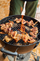 Sizzling chicken wings on the grill burst with smoky flavors and spices