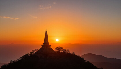 Obraz premium Buddhist temple silhouette at vibrant sunrise, serene elevation
