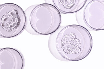 Skin serum or face wash gel in a Petri dish. For cosmetic procedures. White background