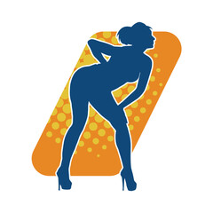 Silhouette of a female dancer in action pose. Silhouette of a slim woman in dancing pose.