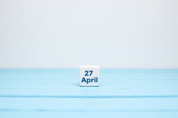 wooden block with the date 27 April on it