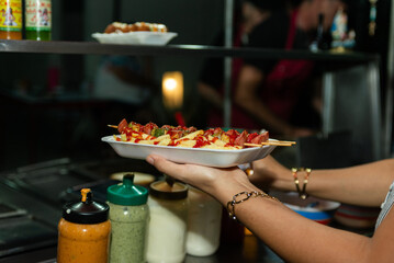 Delicious Street Food Skewers and Fries Served in Styrofoam Tray