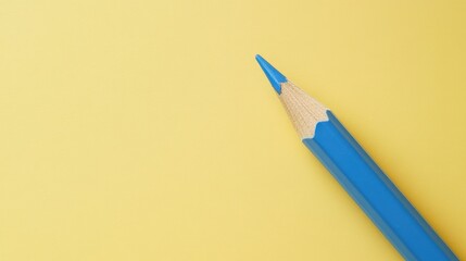 Blue Pencil on Yellow Background: A Minimalist Study