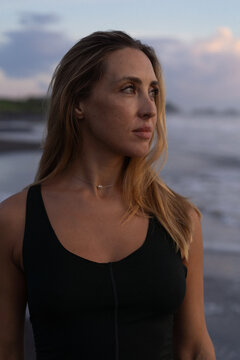 Portrait of a beautiful woman at the beach at sunset