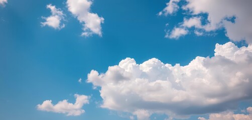 Timelapse of a vibrant blue sky slowly transitioning with fluffy white clouds, horizon, serene