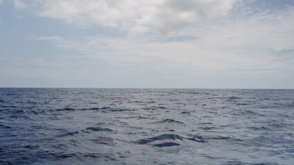 side view from boat in Indian ocean sailing between Seychelles islands in daytime