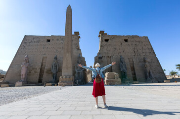 Woman tourist at Luxor Temple in a sunny day, Luxor, Egypt