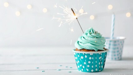 Pastel blue cupcake, polka dot wrapper, swirled frosting, sparkler candle, birthday celebration, soft focus background, white stars, minimalist composition, turquoise and white color palette