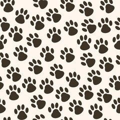 Seamless pattern of black cat tracks on white background 