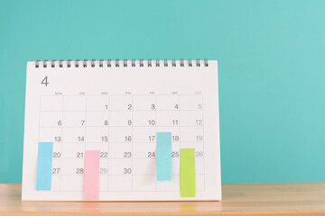 close up of calendar on the green background, planning for business meeting or travel planning concept