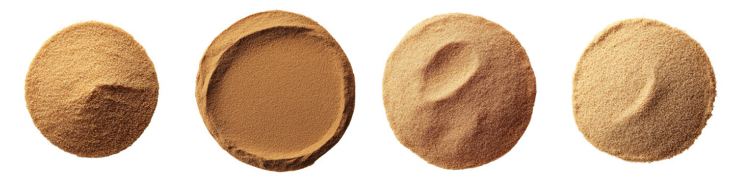 Close up view of different heaps of freshly ground spice powders such as turmeric cinnamon nutmeg cumin ginger and paprika arranged in circular shapes on a neutral background