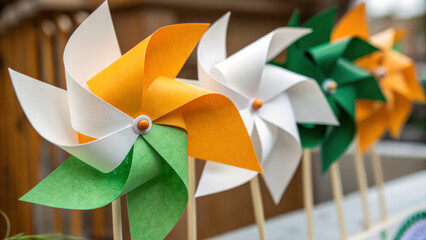 Indian town. Colorful paper pinwheels in green, white, and orange create cheerful display