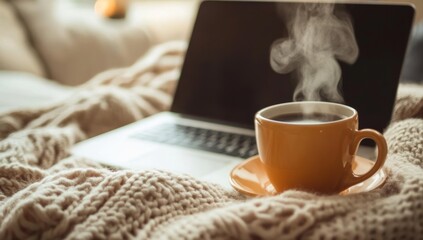 Cozy laptop workspace with coffee