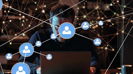 Caucasian man working on laptop while analyzing data connections in a dimly lit environment, network of connections over caucasian man using laptop - Powered by Adobe
