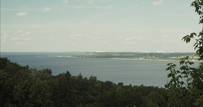 Panoramic view of Volga river with industrial landscape in the distance