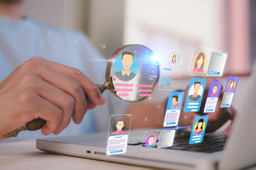 Businessman holding magnifying glass Career managers looking for employees or candidates, HR...