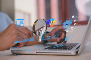 businessman holding magnifying glass looking at virtual ai data chart dashboard in concept of...