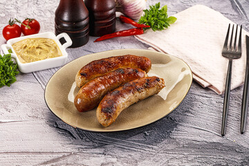 Delicous natural roasted sausages in the plate