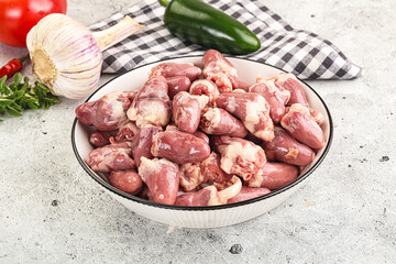 Fresh raw chicken hearts in the bowl