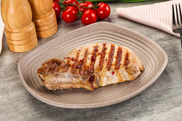 Grilled pork loin steak with bone