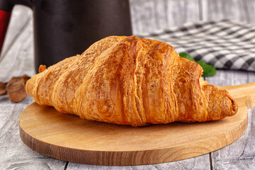 Fresh hot homemade croissant for breakfast
