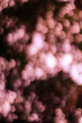 Obraz premium Dreamy Abstract Image of Bokeh Bubbles with Soft Pink and Brown Tones