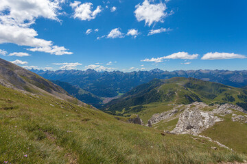 Fototapeta premium Spectacular summer panorama of the Fiemme Valley towards Predazzo village. Lagorai mountain chain in the background. UNESCO world heritage site, Trentino-Alto Adige, Italy, Europe