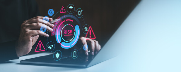 Businessman analyzing risk management strategy with digital interface.