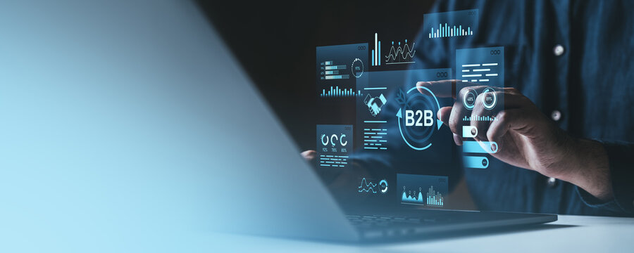 Digital B2B marketing technology concept with businessman using futuristic interface.