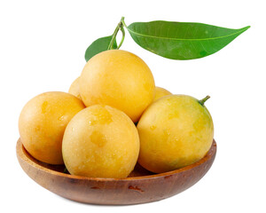A close-up of a wooden bowl filled with ripe Marian plums, set against a white background, with a stem and two leaves extending from the top.
