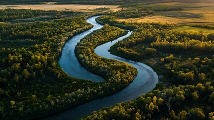 picturesque river cutting through vibrant green fields image