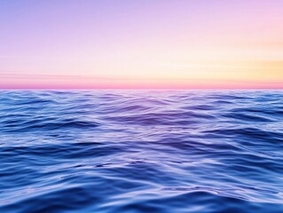 Obraz premium Serene ocean waves under a pastel sunset sky, capturing tranquility and beauty