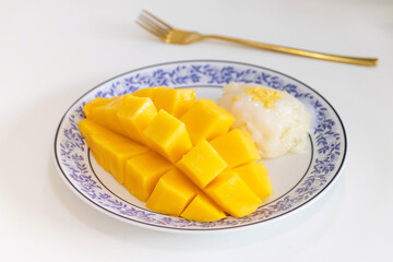 Thai sweet sticky rice with mango (Nam Dok Mai and Ok-Rong). Thai style tropical dessert, glutinous rice eat with mango.